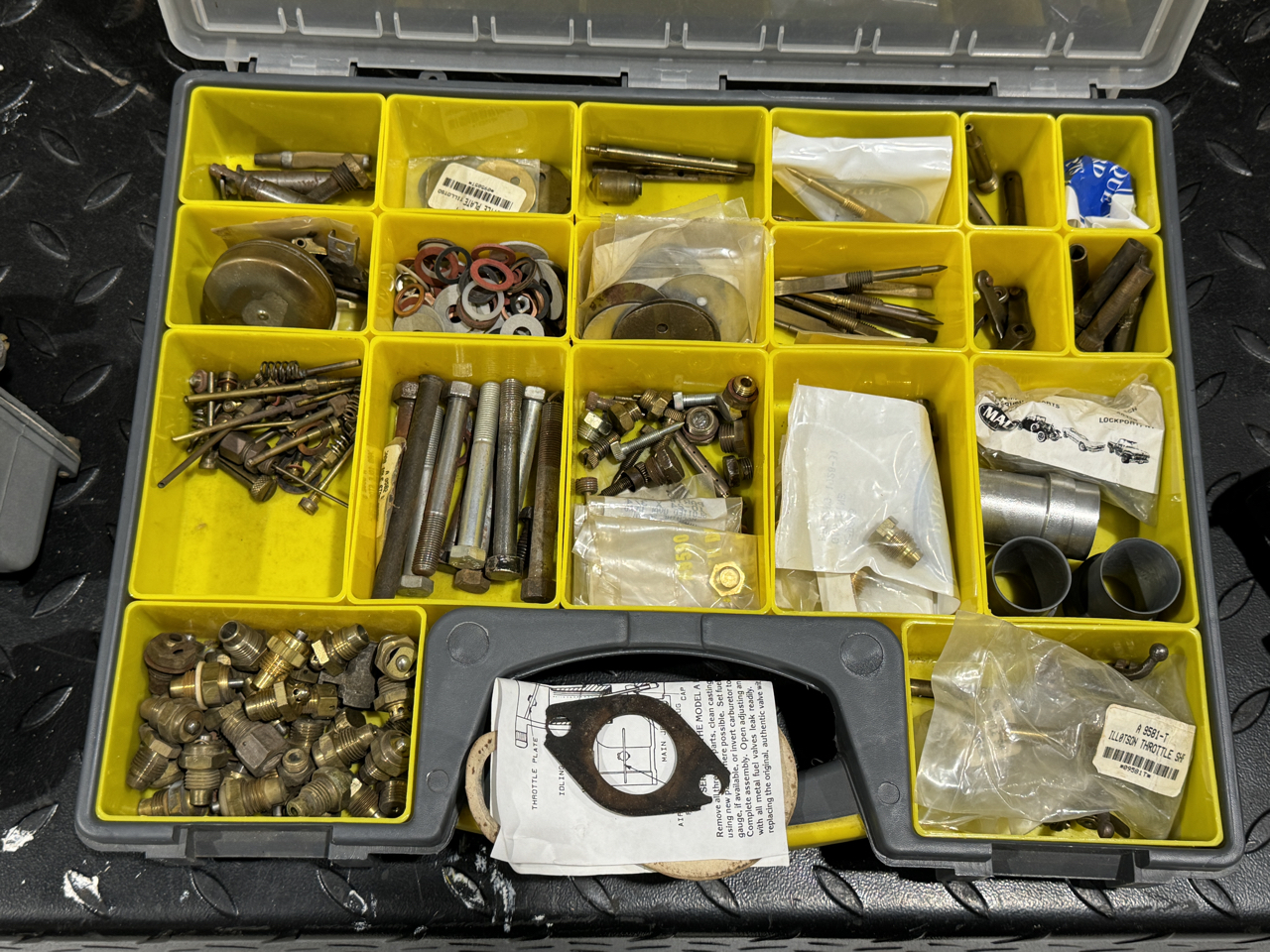 Carburetor parts in tote.