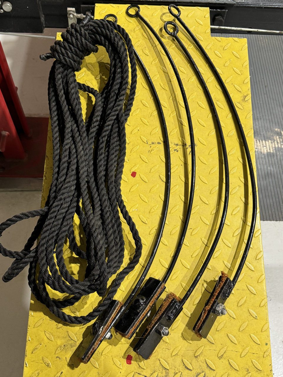 Four display rope posts that clamp to the bumpers and black rope to go around car at shows