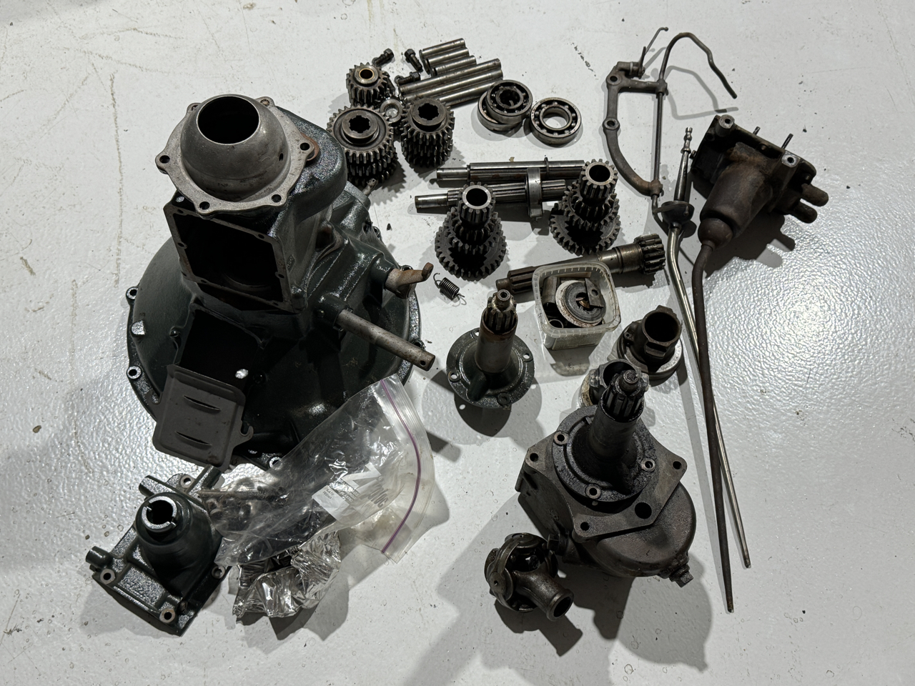 Transmissions (2), bell housing and various parts